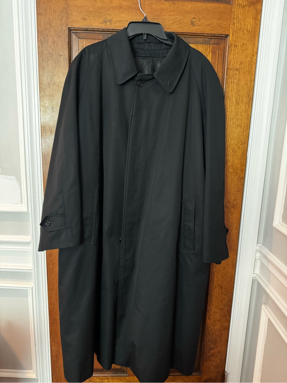 Men's Black Long Burberry trench coat.
